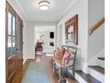 Inviting foyer with hardwood floors, stylish decor, and ample natural light, creating a warm welcome at 435 Grenock Cir, Atlanta, GA 30328