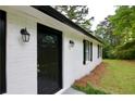 Close-up of the front door, showcasing the fresh exterior paint and updated fixtures at 537 Eastside Dr, Dacula, GA 30019