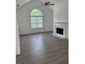 Spacious living room with fireplace and large window for natural light at 5709 Newnan Cir, Austell, GA 30106