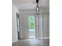 Bright living area featuring modern lighting and sliding door to balcony at 5709 Newnan Cir, Austell, GA 30106