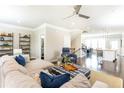 Open-concept living room offering sleek dark hardwood floors, view of kitchen, and neutral color palette at 3133 Quinn Pl, Atlanta, GA 30341