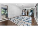 Spacious living room showcasing hardwood floors, custom paneling, and designer rug at 1180 Branch Water Ct, Dunwoody, GA 30338