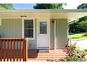 Inviting front porch with decorative railing and a white front door at 2100 Shady Ln, Tucker, GA 30084
