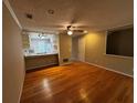 Inviting living area featuring hardwood floors, ample natural light, and an open layout to the kitchen at 351 Oak Harbor Trl, Marietta, GA 30066