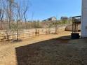 Large fenced backyard with newly laid sod, perfect for outdoor activities and privacy at 3836 Saddle Hill Way, Douglasville, GA 30135