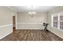 Spacious dining room with natural light, featuring modern floors and classic trim at 4375 Split Creek Dr, Douglasville, GA 30135