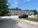 Attractive townhouse complex with well-kept grounds and convenient parking at 2858 Parkway Close, Lithonia, GA 30058
