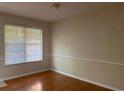 Bright room with hardwood floors, natural light, and neutral-toned walls provides a blank canvas at 2858 Parkway Close, Lithonia, GA 30058