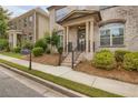 Beautiful brick home exterior with landscaped front yard and covered entryway at 4204 Hardy Ave, Smyrna, GA 30082