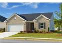Charming single-story brick home featuring an attached two-car garage and well-manicured front lawn at 740 Pineberry Ct, Grayson, GA 30017