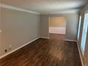 The living room features sleek flooring and crown moulding details at 1093 Hasty Sw Ct, Lilburn, GA 30047
