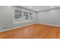 Bright living room featuring gleaming hardwood floors, fresh paint, and large windows offering plenty of natural light at 2002 Twin Falls Rd, Decatur, GA 30032
