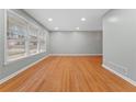 Spacious living room featuring hardwood floors, neutral paint, recessed lights and multiple windows at 2002 Twin Falls Rd, Decatur, GA 30032