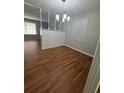 Open dining area features new wood flooring and updated lighting at 2266 Eastgate Dr, Snellville, GA 30078