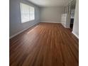 Spacious living room featuring wood-look floors and neutral paint at 2266 Eastgate Dr, Snellville, GA 30078