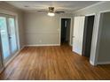Bright living room features hardwood floors, neutral walls and french doors at 3551 Skyline Sw Ter, Marietta, GA 30008