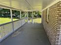 Expansive covered porch offering ample space for outdoor seating and entertaining at 3551 Skyline Sw Ter, Marietta, GA 30008