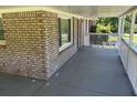 Spacious covered porch with brick accents, a perfect spot to enjoy the outdoors at 3551 Skyline Sw Ter, Marietta, GA 30008