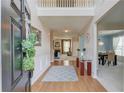 Inviting foyer with hardwood floors, high ceilings, and a view of the dining and living areas at 2990 Haynes Club Cir, Grayson, GA 30017
