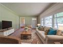 Comfortable living room with a sofa, area rug, and large windows for natural light at 5167 Hiram Lithia Springs Rd, Powder Springs, GA 30127