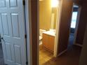 Half bathroom featuring a single vanity and lighting at 8202 Fairington Village Dr, Lithonia, GA 30038