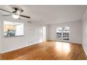 Spacious living room with hardwood floors, bright lighting, and access to an outdoor area at 1150 Collier Nw Rd # K9, Atlanta, GA 30318