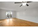 Large living room with hardwood floors and glass doors leading to an outdoor space at 1150 Collier Nw Rd # K9, Atlanta, GA 30318