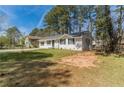 Lovely single story home with a fresh white paint and spacious front yard at 80 Crystal River Dr, Riverdale, GA 30274