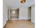 Bright and airy living room showcasing hardwood flooring, neutral paint, and modern lighting at 80 Crystal River Dr, Riverdale, GA 30274