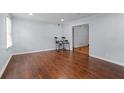 Spacious living room featuring hardwood floors and ample natural light at 3626 Buford Ne Hwy # C1, Brookhaven, GA 30329