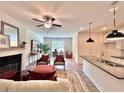 Cozy living area featuring a fireplace, modern furniture, and an open-concept layout at 1824 Emory Ln # 88, Conyers, GA 30013