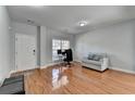 Cozy living room with hardwood floors, a large window, and comfortable seating at 2425 Delamore Chase, Duluth, GA 30097