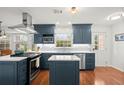 Modern kitchen with navy cabinets, stainless steel appliances, and white countertops at 3999 Brintons Ml, Marietta, GA 30062