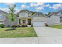 Charming two-story home features a covered front porch and attached two car garage at 7760 Hansel Ln, Lithonia, GA 30058