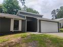 Beautiful home featuring white trim and a spacious two-car garage at 2645 Trotters Walk Trl, Snellville, GA 30078