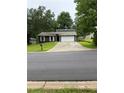 Charming single-Gathering home featuring a driveway and a well-maintained front lawn at 2645 Trotters Walk Trl, Snellville, GA 30078