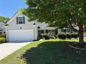 Beautiful home with lush landscaping, a two-car garage, and a welcoming front porch at 1028 Southwood Dr, Villa Rica, GA 30180