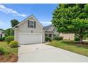 Lovely home featuring a well-maintained lawn, two-car garage, and traditional design at 1028 Southwood Dr, Villa Rica, GA 30180