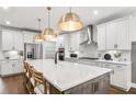 Modern kitchen with a large island, stainless steel appliances, and ample counter space at 2905 Medford Drive, Cumming, GA 30041
