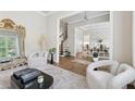 Stylish living room featuring hardwood floors, decorative furniture, and an open floor plan at 3998 Commodore Dr, Atlanta, GA 30341
