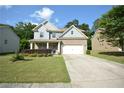 Beautiful two-story home with a well-maintained lawn and a spacious driveway at 2307 Overlook Ave, Lithonia, GA 30058