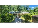 Traditional brick home featuring a charming walkway and lush green landscaping at 2663 Washington Nw St, Atlanta, GA 30318