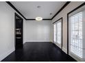 Bright dining room with dark hardwood floors and access to outdoor balcony at 2767 Durham Ne Dr, Atlanta, GA 30319
