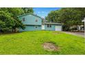 Charming two-story home featuring an attached garage and well-maintained lawn at 1328 Hoy Taylor Dr, Norcross, GA 30093