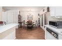 Cozy dining area featuring hardwood floors, chandelier, and elegant furnishings at 3244 Hampton Se Ct, Smyrna, GA 30082