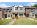 Charming townhome with brick facade, dormer windows, and inviting front lawn at 3244 Hampton Se Ct, Smyrna, GA 30082