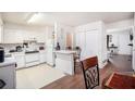 Functional kitchen featuring wood floors, ample counter space, and essential appliances at 3244 Hampton Se Ct, Smyrna, GA 30082