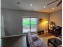 Bright living room boasts dark wood floors, a large window and recessed lighting for a modern feel at 1067 Brownstone Dr # 23, Marietta, GA 30008