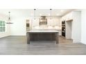 Spacious kitchen with stainless steel appliances, granite countertops, and a large center island at 2117 Ella Springs Dr, Covington, GA 30014