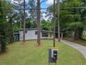 Charming one-story home with a long driveway and a well-maintained lawn at 2575 Flagstone Se Dr, Atlanta, GA 30316